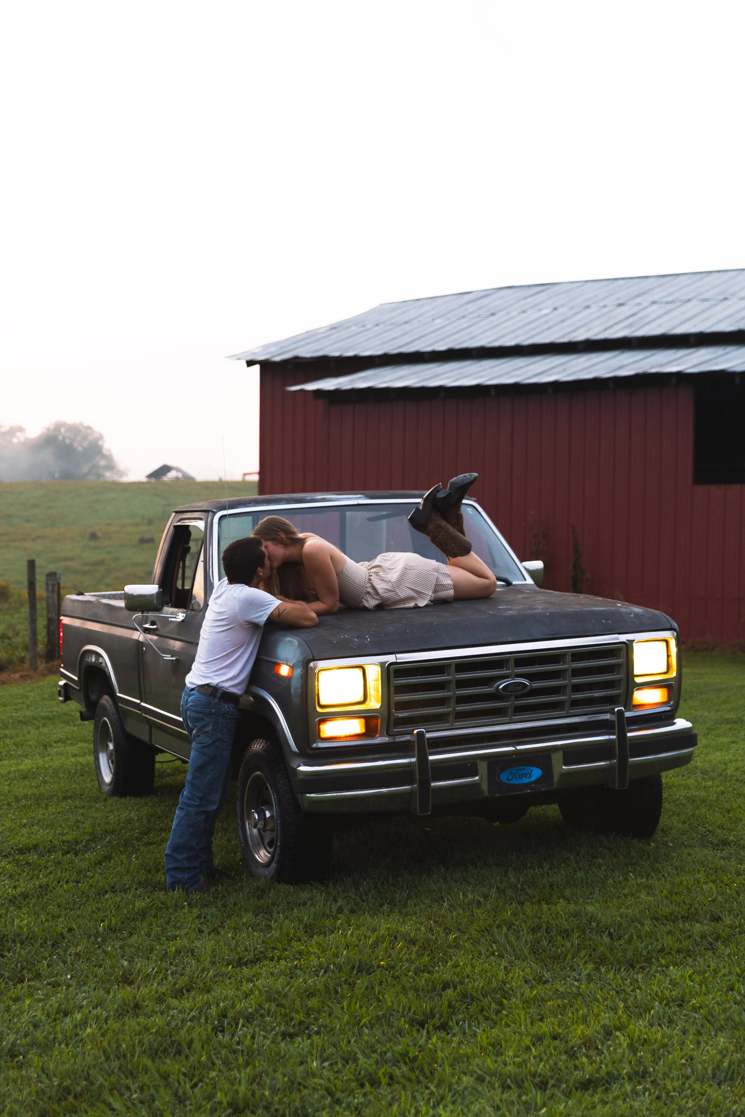 Couple kissing on a truck