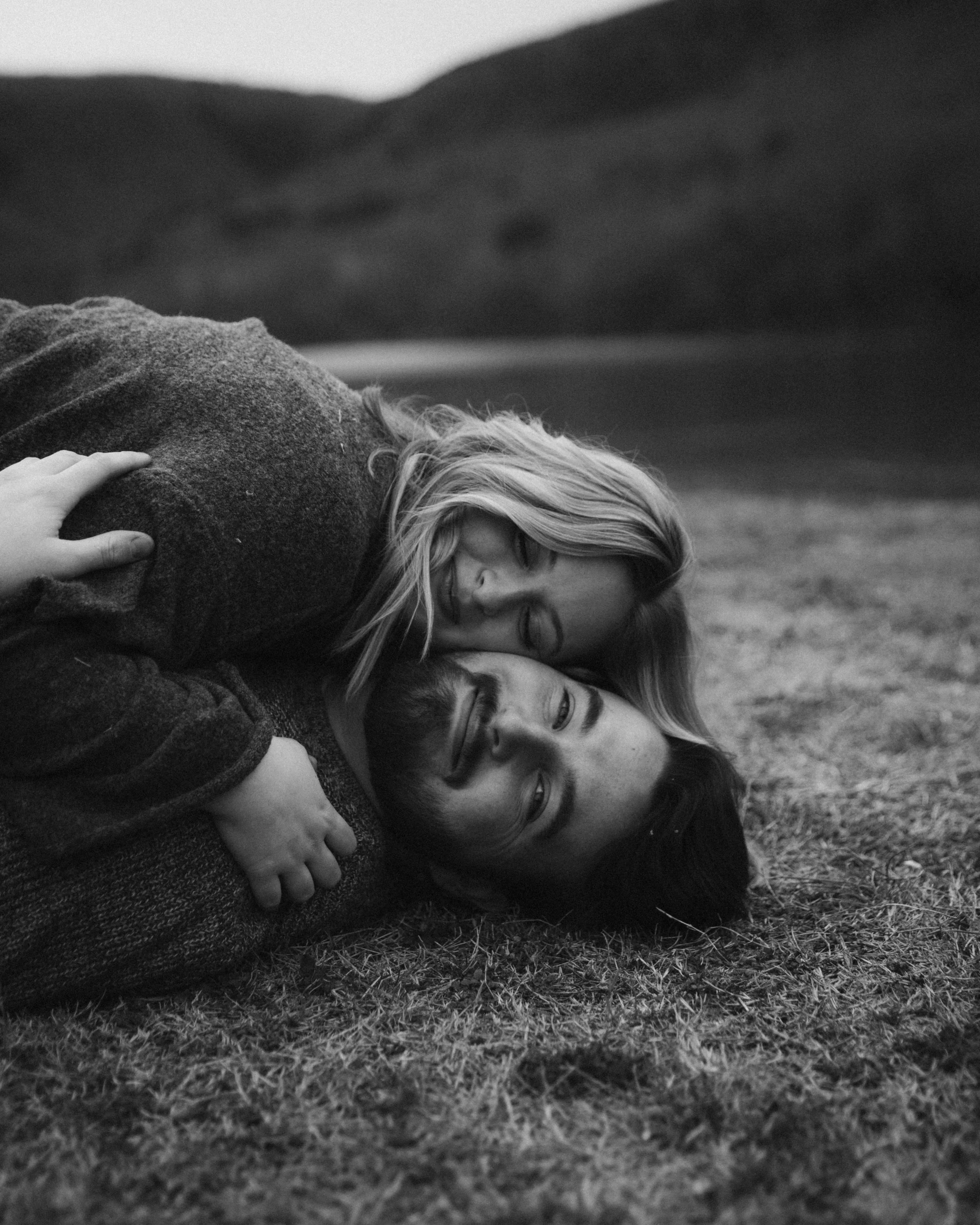 couple embracing on the ground