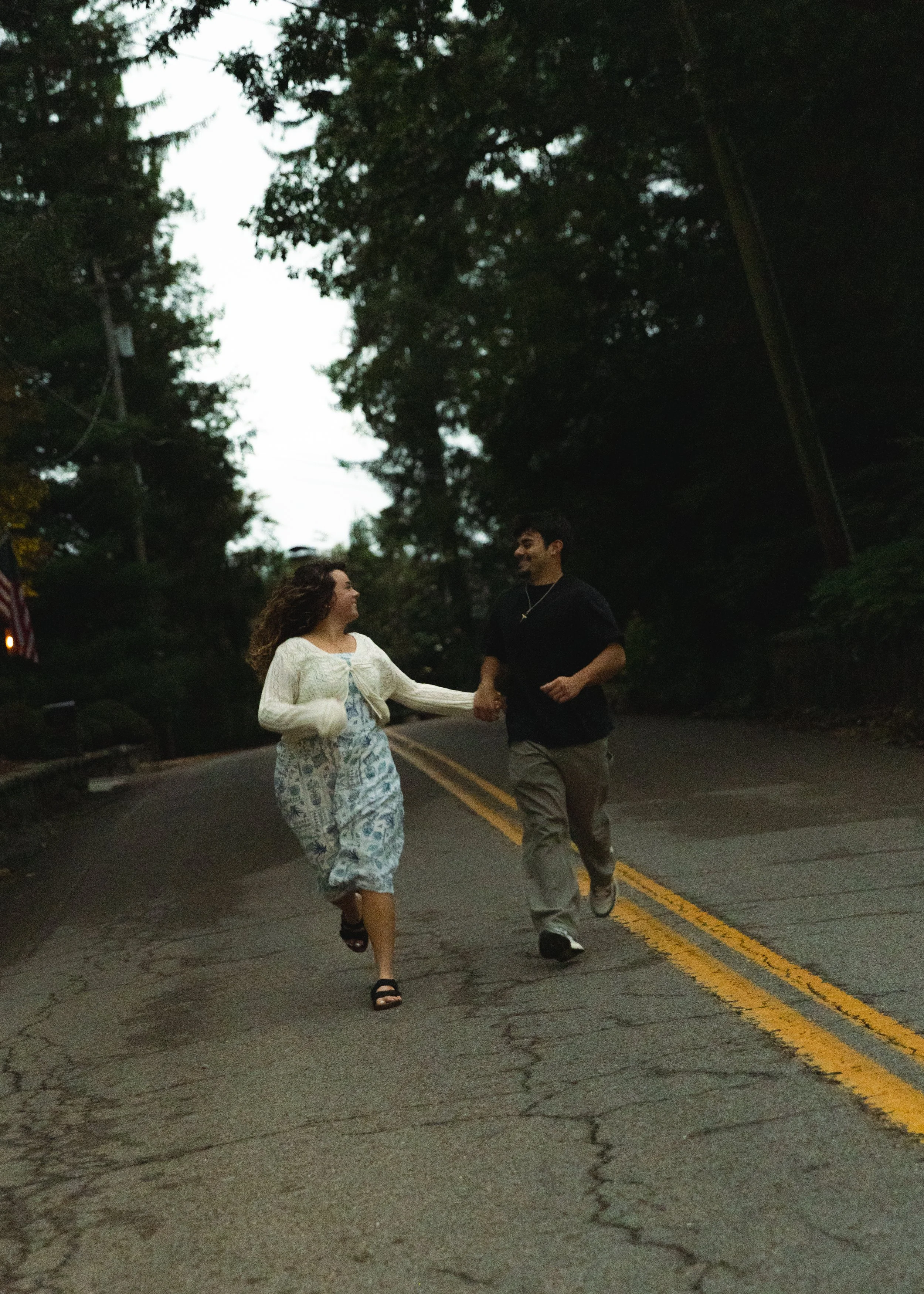 Couple holding hands in the road