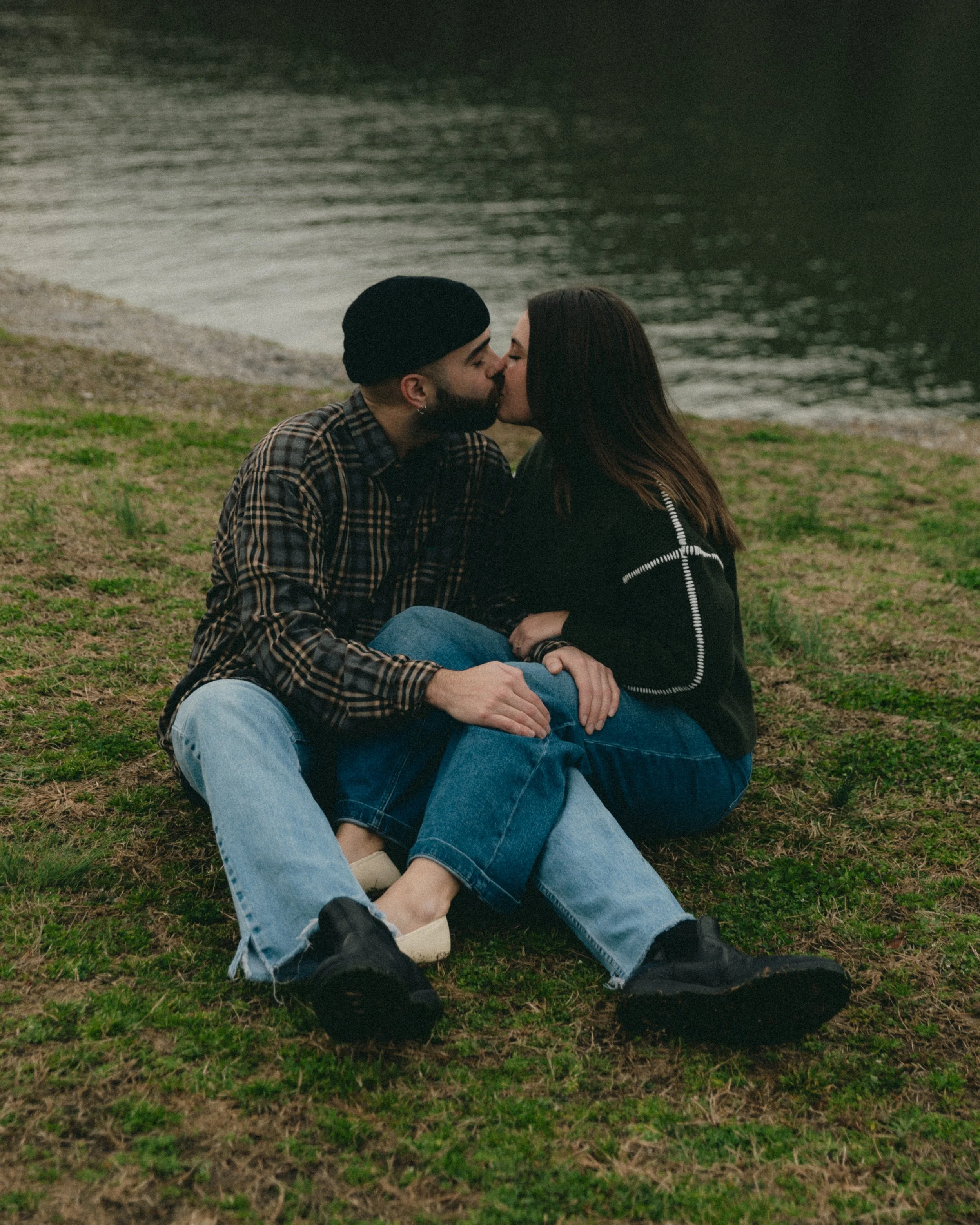 couple sitting down kissing