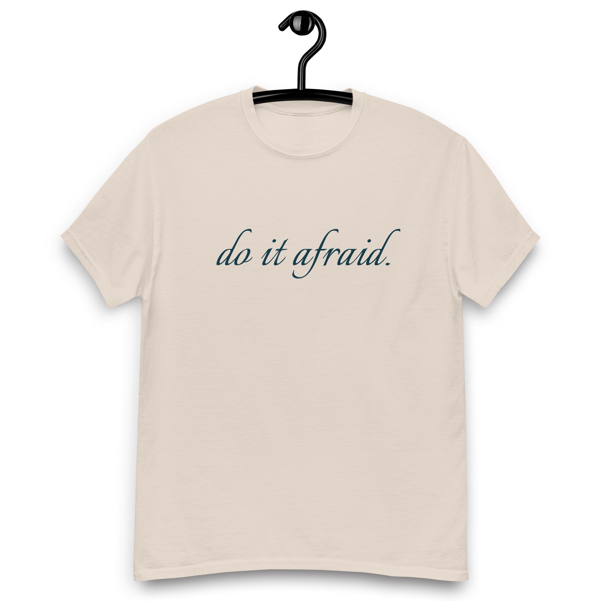 Do it Afraid tan tshirt hanging on a black hanger
