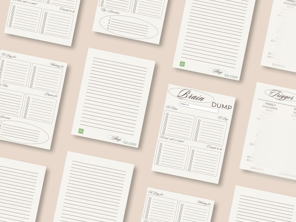 aesthetic neutral worksheets product page - tan background with aesthetic pages scattered on top