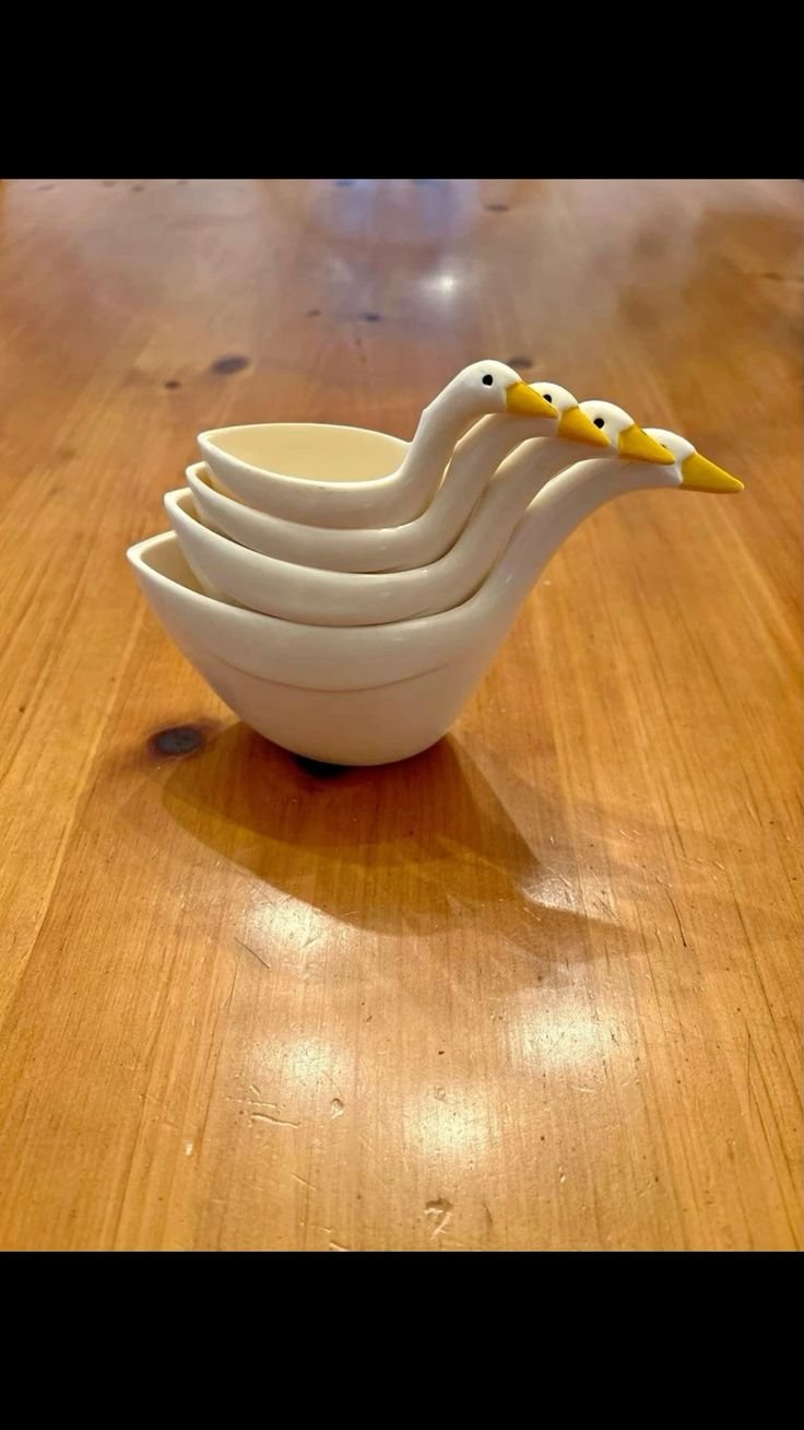 thrifted goose wearing cups for the kitchen 