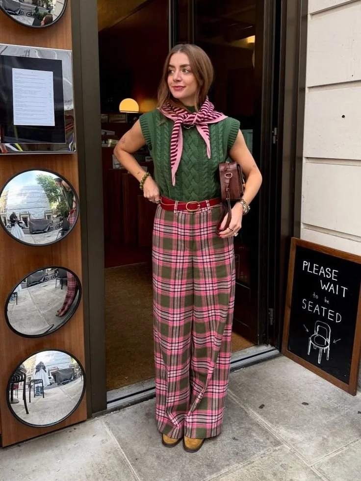 green sweater vest and green and pink plaid pant outfit