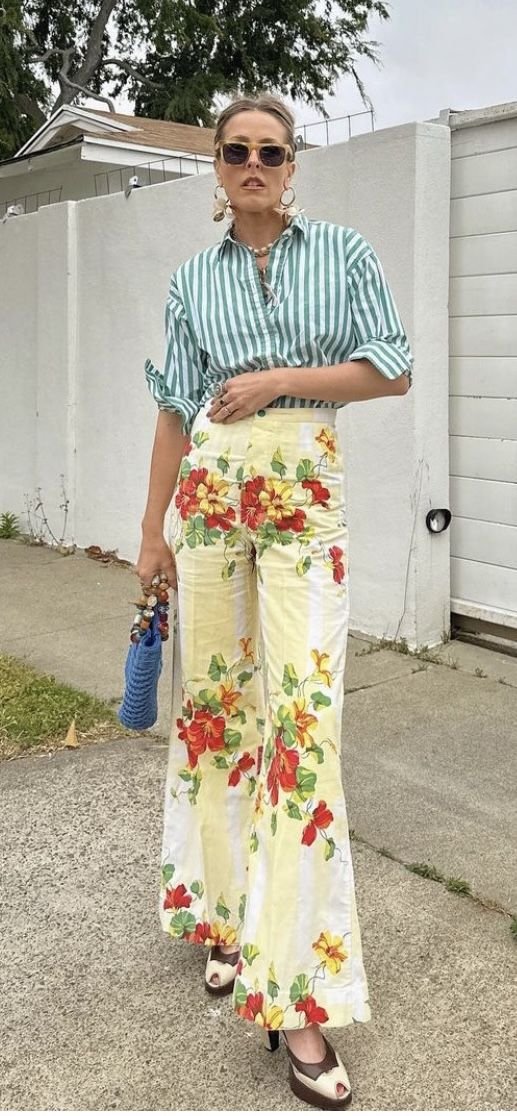 green and white striped button up styled with floral print pants