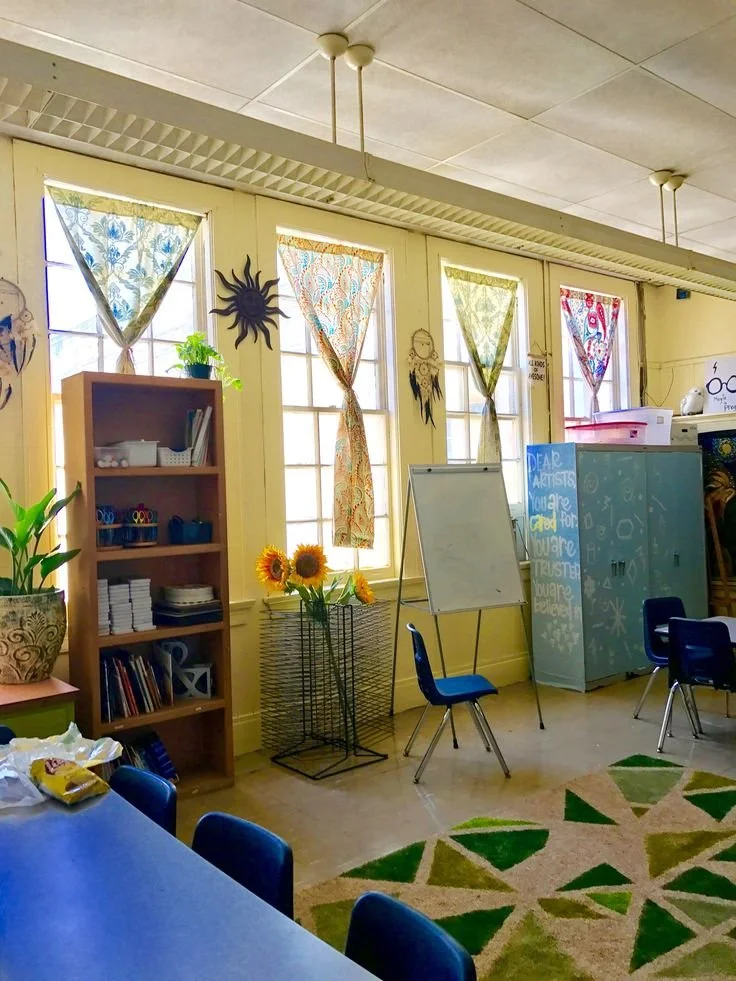 crating cozy lighting and feels in a classroom with curtains hanging in the windows