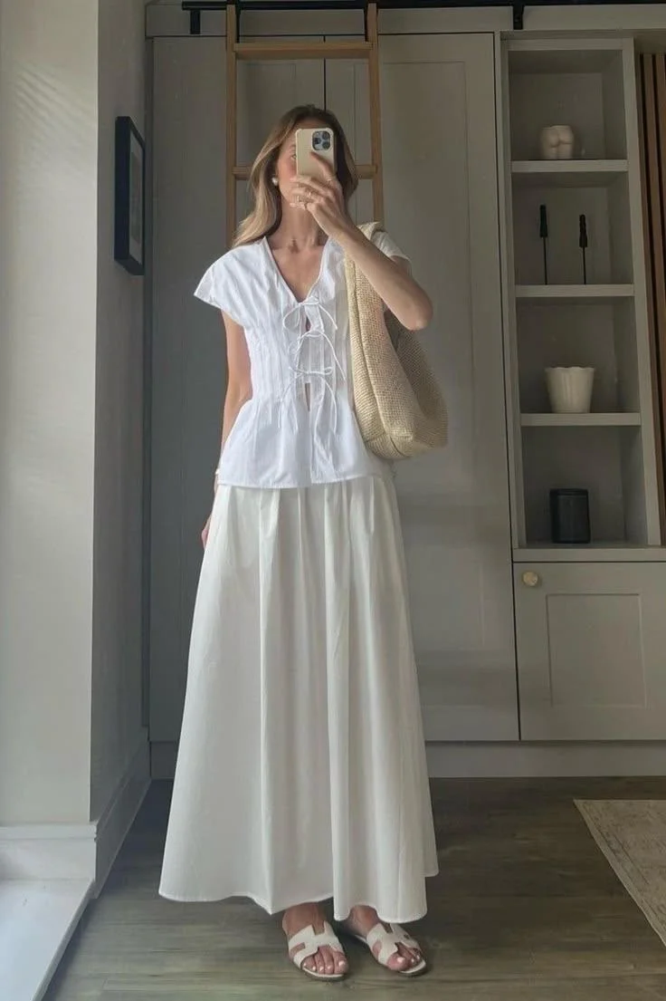 white bow front tie top paired with a white linen maxi skirt for a custom and cool summer outfit for women