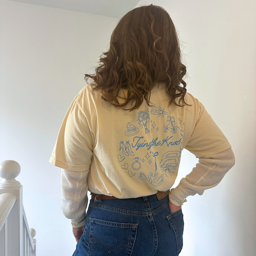 back of tying the knot t-shirt in ivory.png