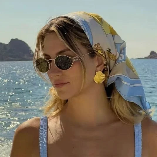 gold shell earrings, a blue white, and yelllow silk head scarf, and sunglasses to spice up a simple summer outfit for women