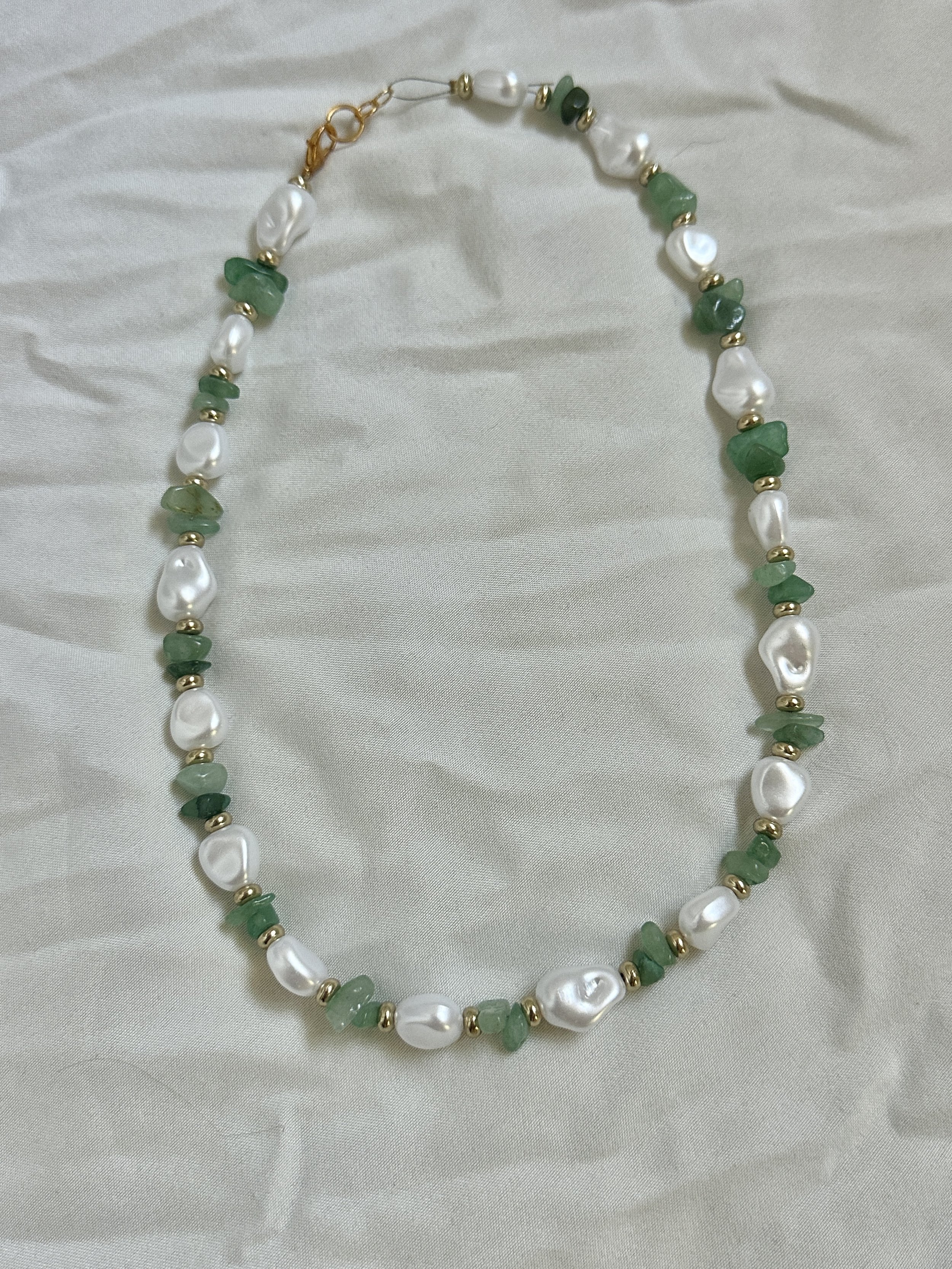 Jade chip beads, freshwater irregular pearl, and gold coin spacer bead necklace with a gold lobster clasp closure, made for women