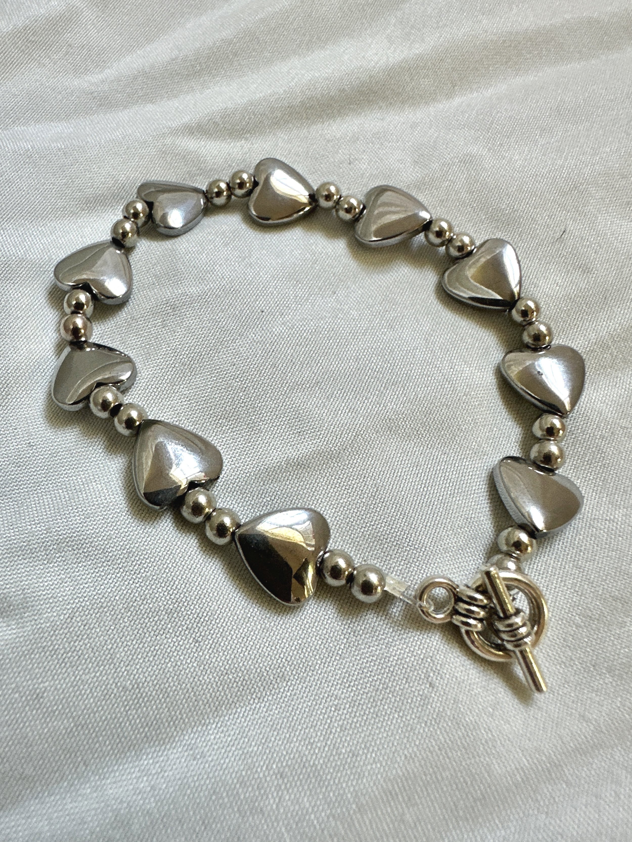 handmade one of a kind silver bracelet for women with heart charms