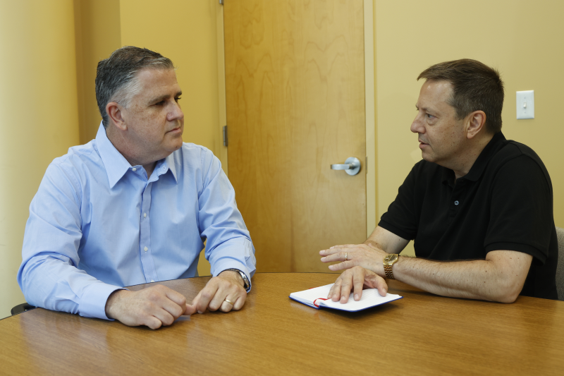 Arthur discussing branding with clients.