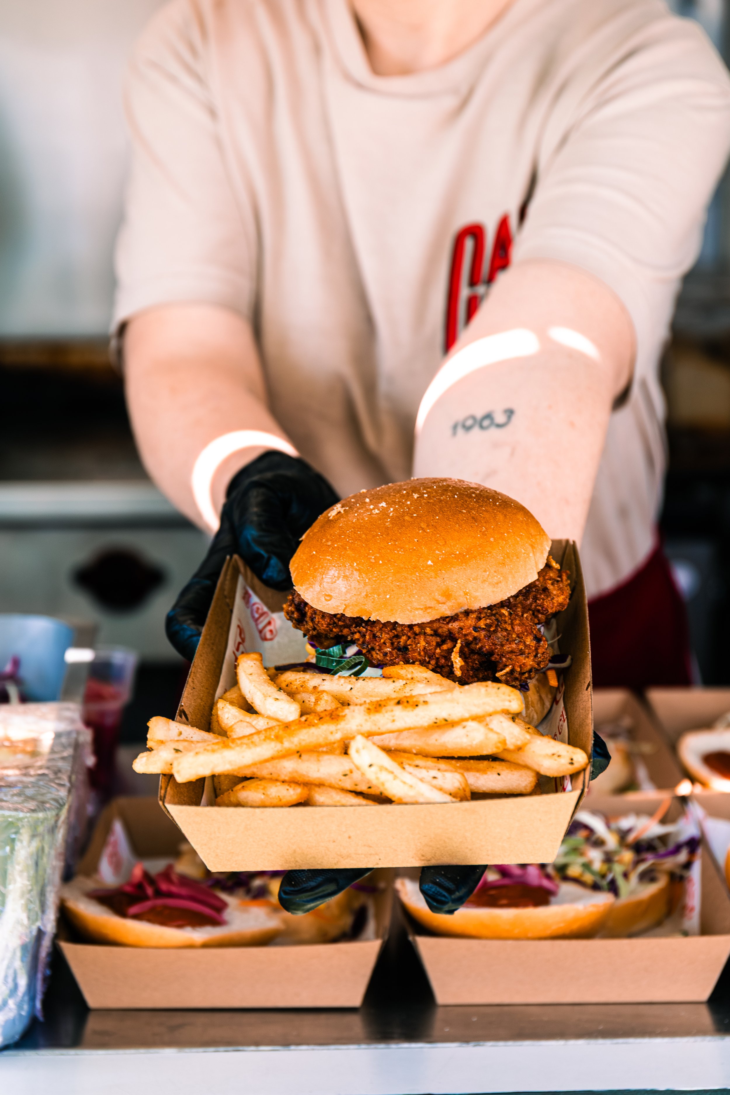 Fried chicken burger with slaw and Memphis sauce on a brioche bun"