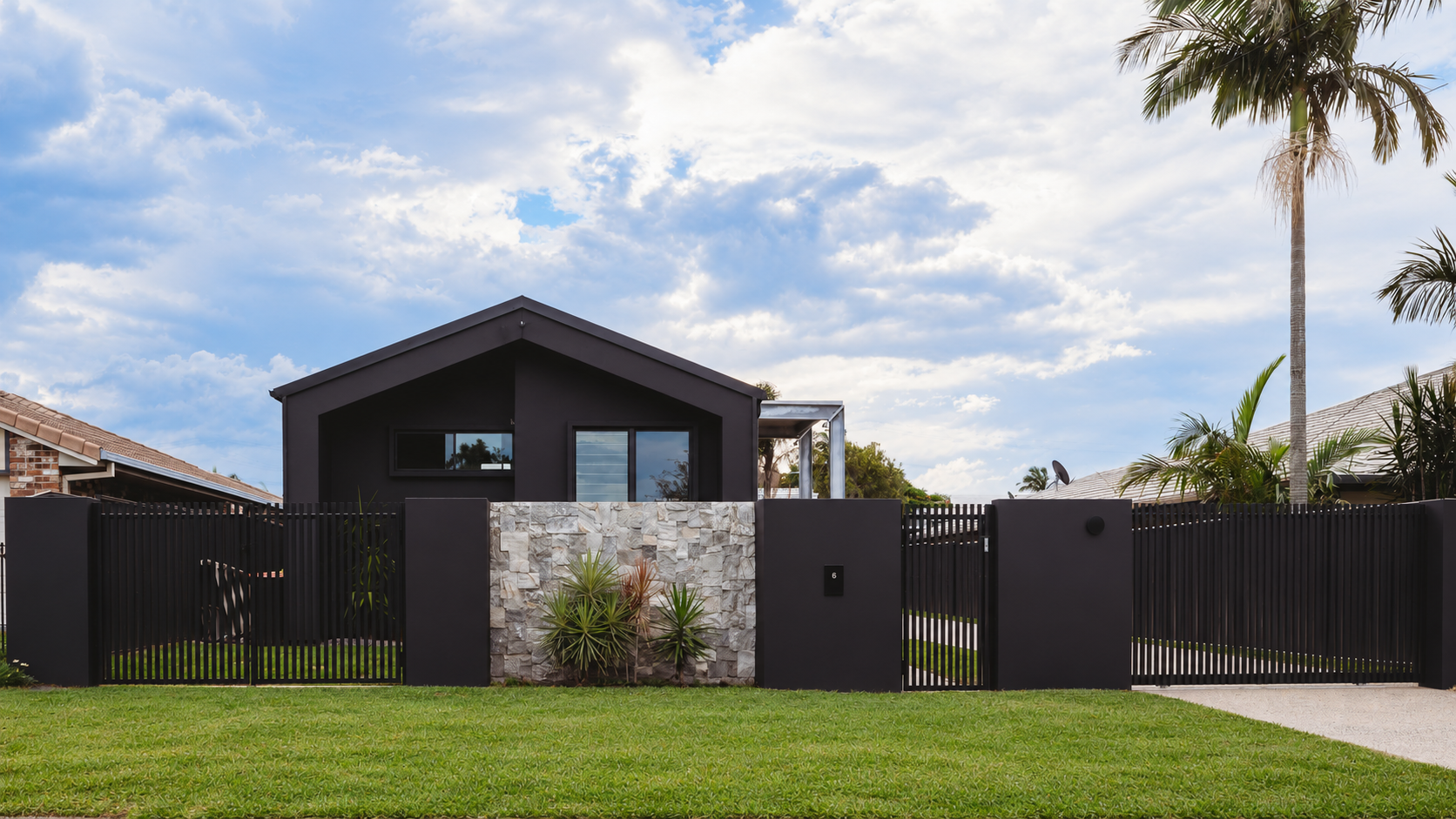 Modern Charcoal Home and Tropical Front Yard.png