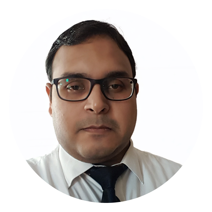 Headshot of Deep - an Indian male wearing glasses and a black jacket, looking at the camera.