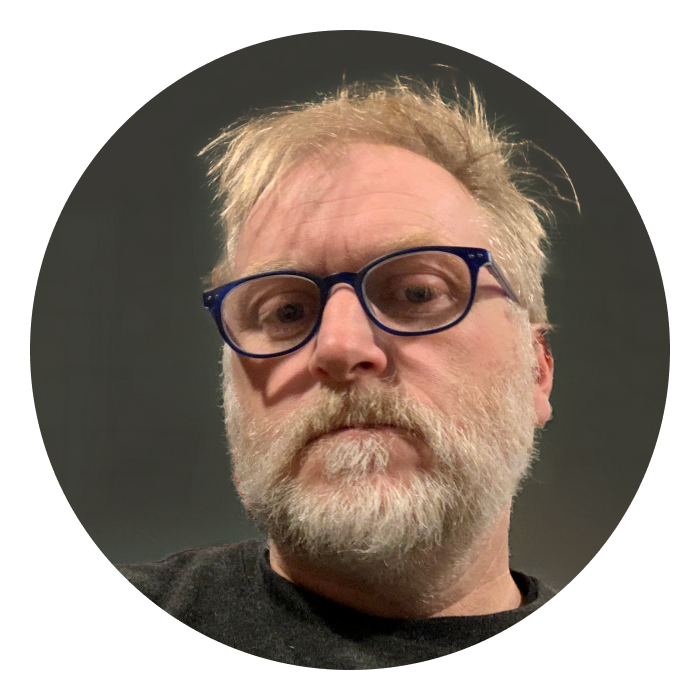 Ben is a middle aged Caucasian man with blonde hair and beard, and wearing glasses.