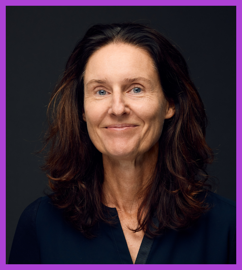 Headshot of Barbara - a middle-aged Caucasian woman with dark brown hair and wearing a navy top, slightly smiling at the camera.