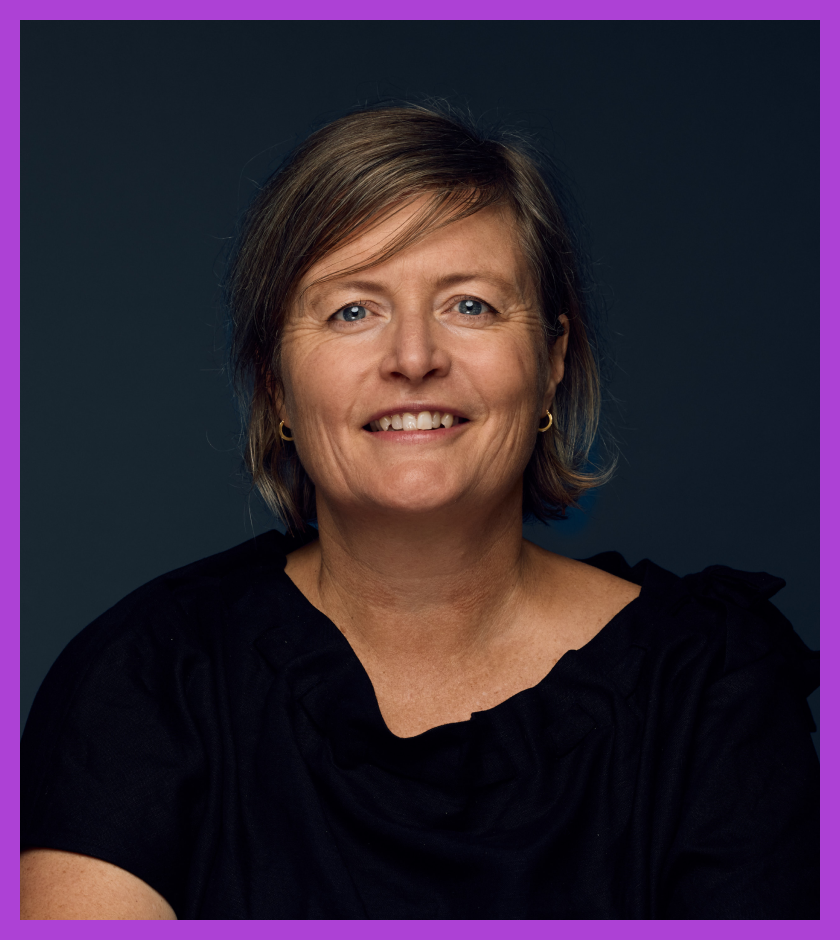 Rachel is a middle-aged Caucasian woman with dark blonde hair, wearing a black top and smiling at the camera.