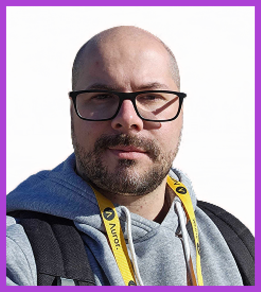 Alteiris is a middle-aged Brazilian man with a bald head, dark eyes, and a beard. Alt is wearing a light gray hoodie and looking at the camera.