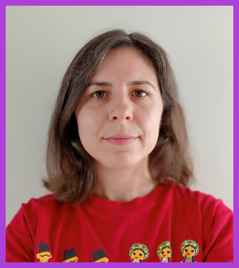 Headshot of Laura - a light skinned woman with light brown hair and wearing a red tshirt, slightly smiling at the camera.