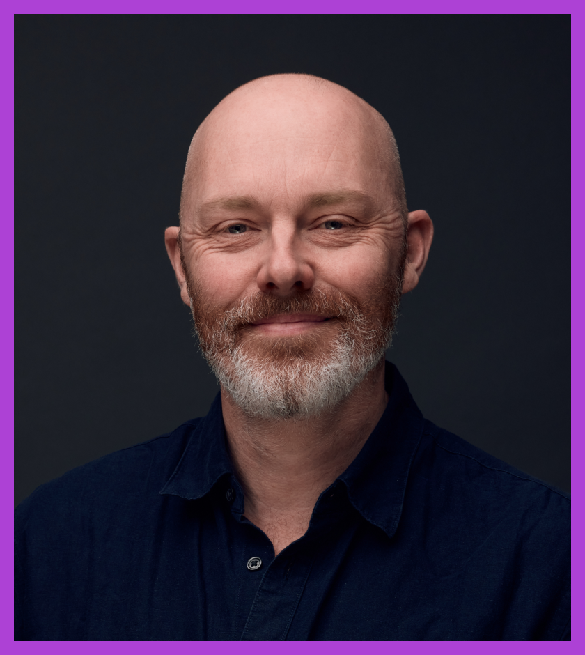 Headshot of Steve Barnett - middle-aged white man, bald, brown beard with white bits, wearing a dark navy shirt.