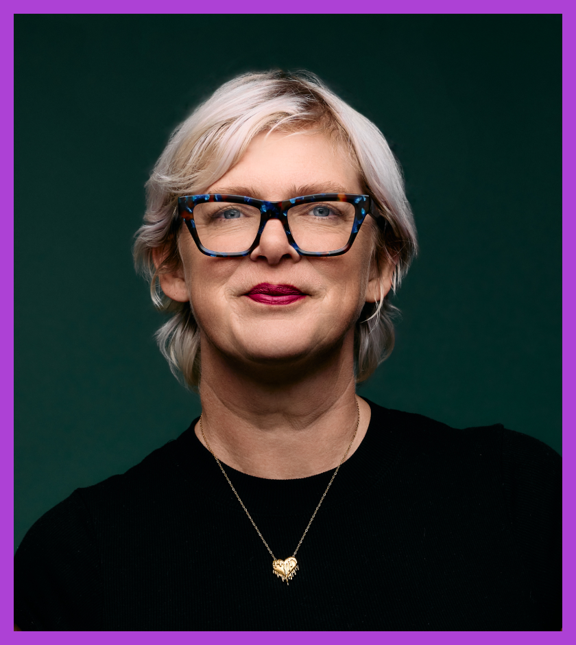 Racheal is a Caucasian woman with blonde hair and wearing a black top, smiling at the camera.