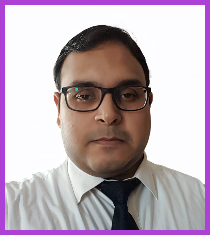 Headshot of Deep - an Indian male wearing glasses and a black jacket, looking at the camera.