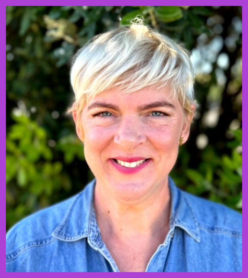 Headshot of Racheal - a Caucasian woman with blonde hair and wearing a light blue shirt, smiling at the camera.