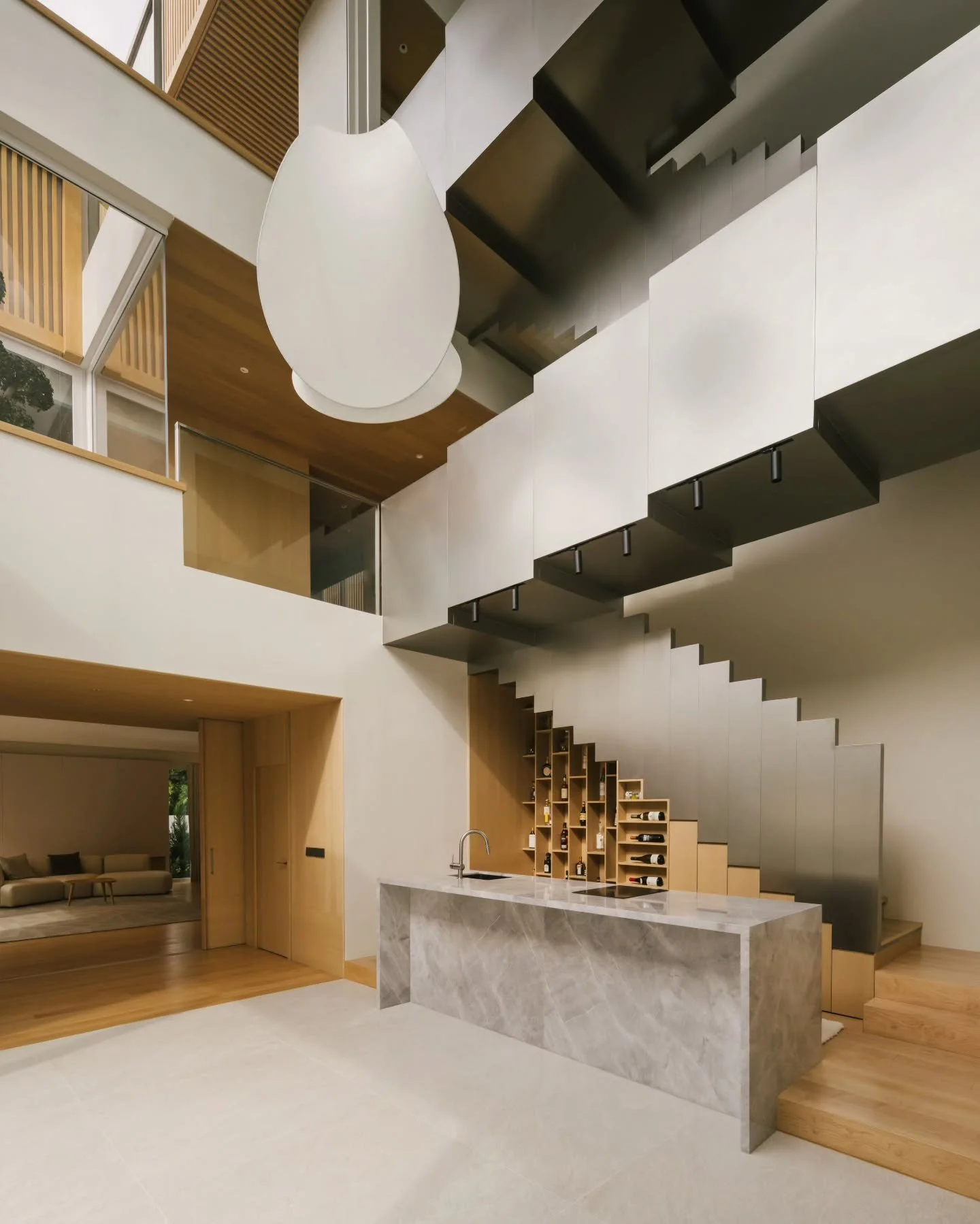 House of Passing Light

The design treats light as a primary building material. The triple-volume void anchors the home as an apparatus for capturing diurnal shifts and translating them into a spatial narrative. As the sun moves, the void brightens, 