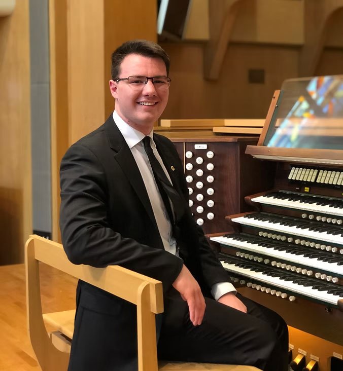 Andrew Johnson sitting at an organ.