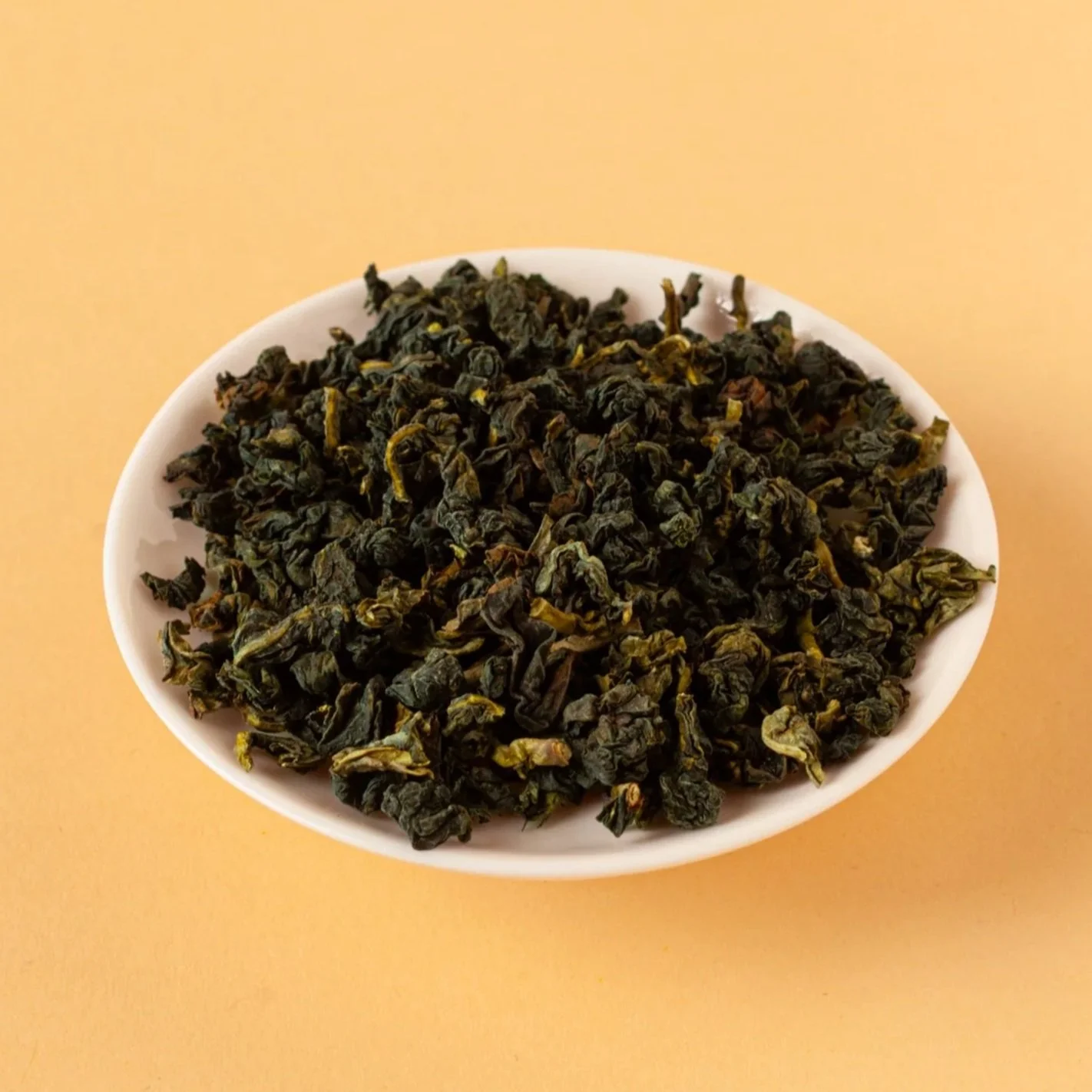 volition tea golden tgy tie guan yin osmanthus oolong tea leaves close up