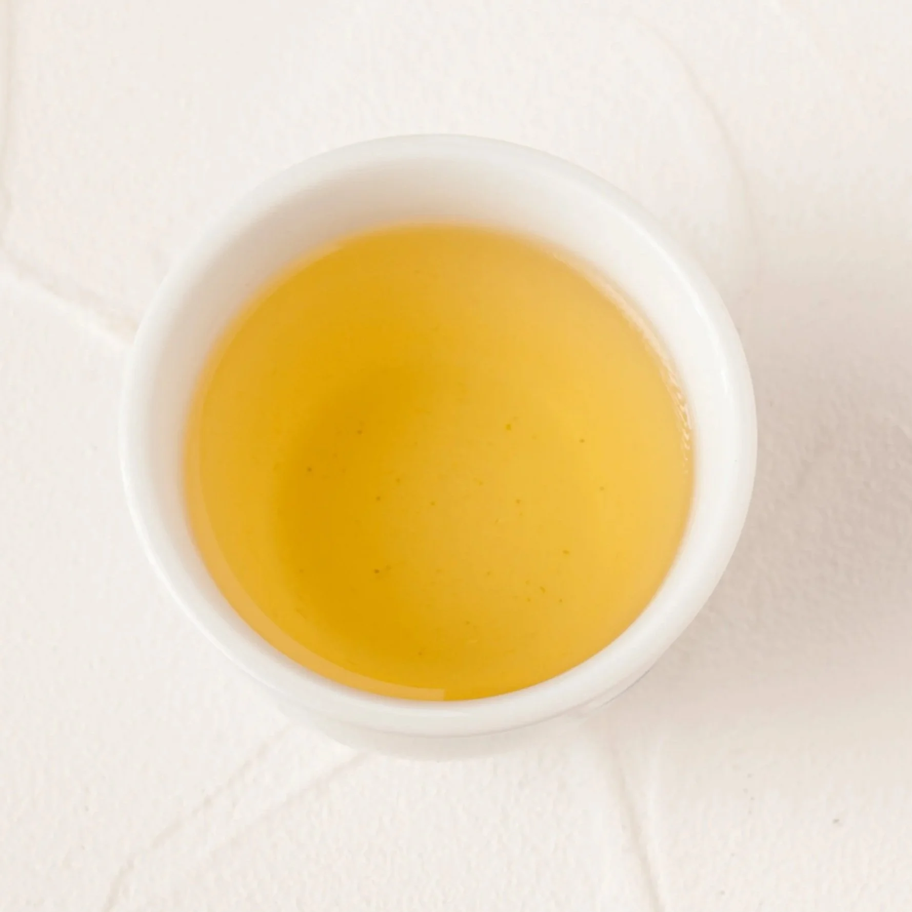 volition tea golden tgy tie guan yin osmanthus oolong tea close up