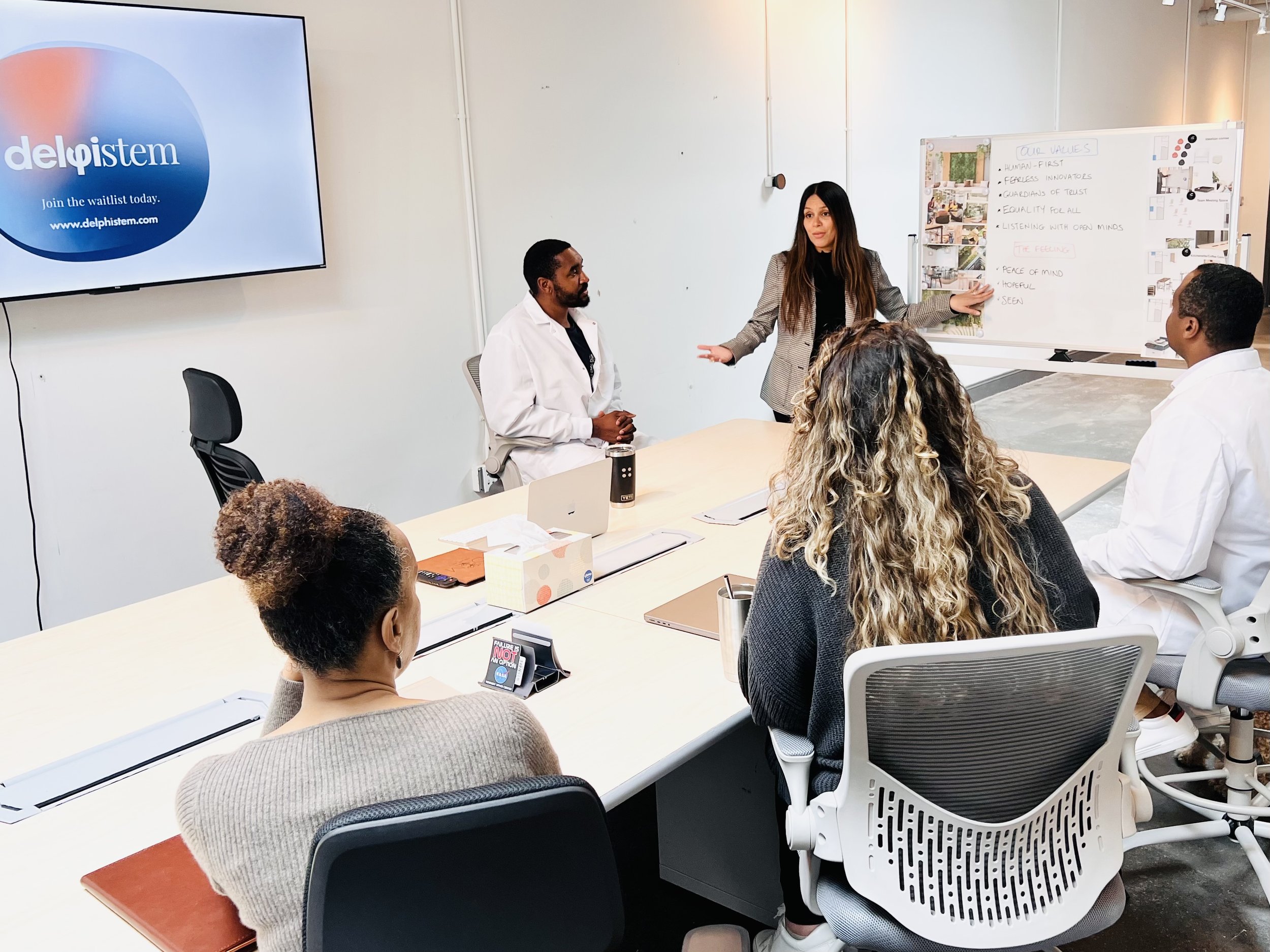 Danae Moya, MBA, delphistem COO & Co-Founder presenting to delphistem team