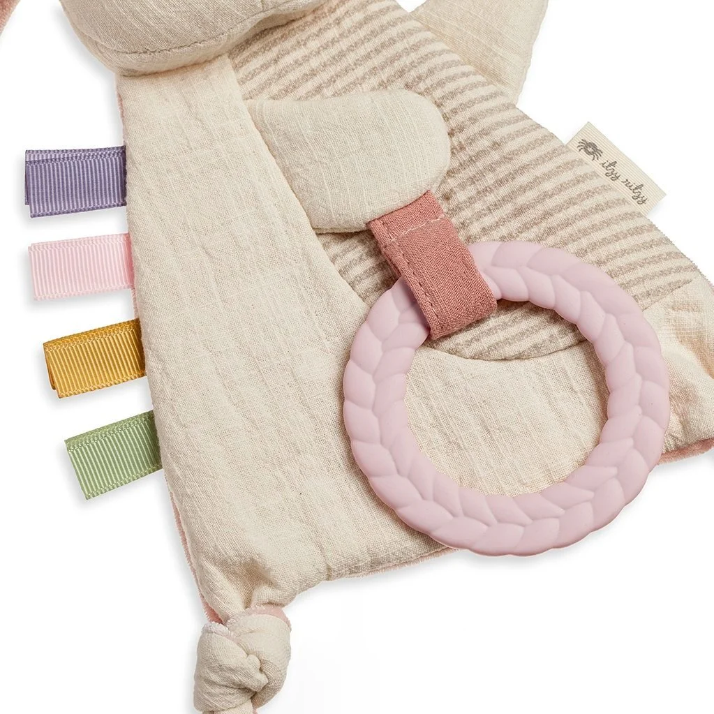 Close up image of the bunny's ribbons, one knot, and teether.