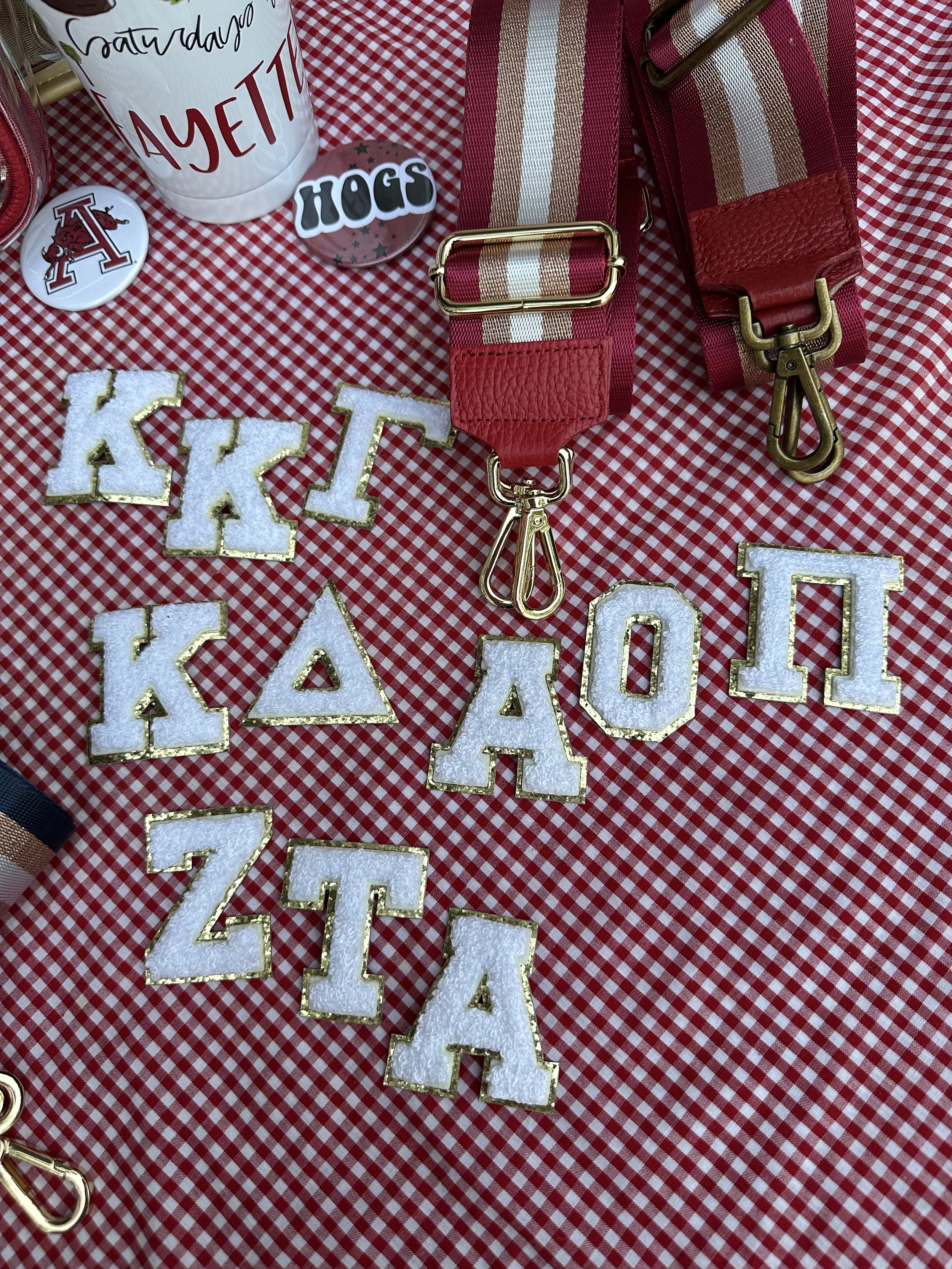 Cute white chenille letters edged in gold glitter. Pictured are Kappa, KD, AOII, and ZTA.