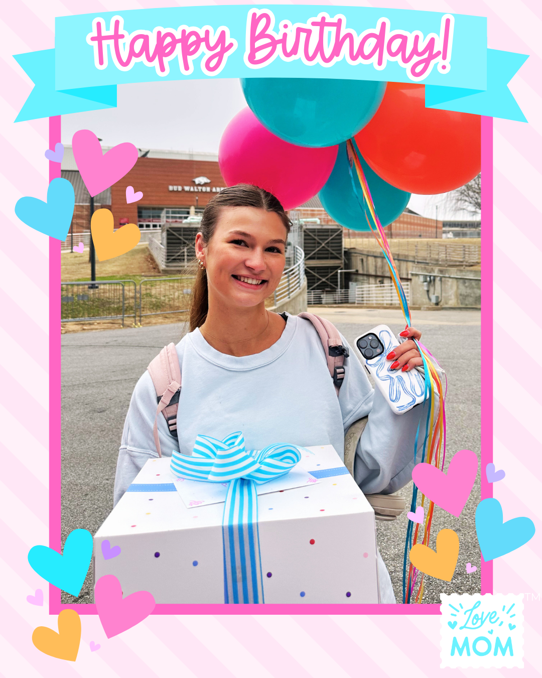 Young lady holding balloons and bundtinis celebrating her birthday on campus.