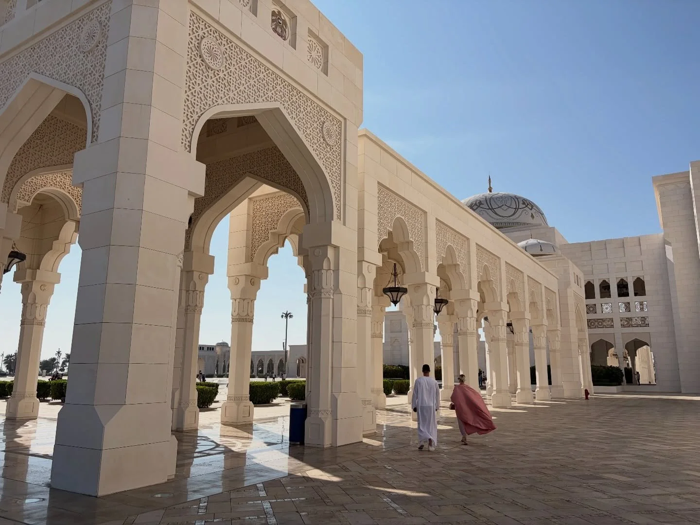 This is one of my favourite photos I took on our trip. We were just leaving the Qasr Al Watan Presidential Palace in Abu Dhabi and I saw these two tourists. The light and her pink robe flying in the wind were so beautiful I couldn&rsquo;t help myself