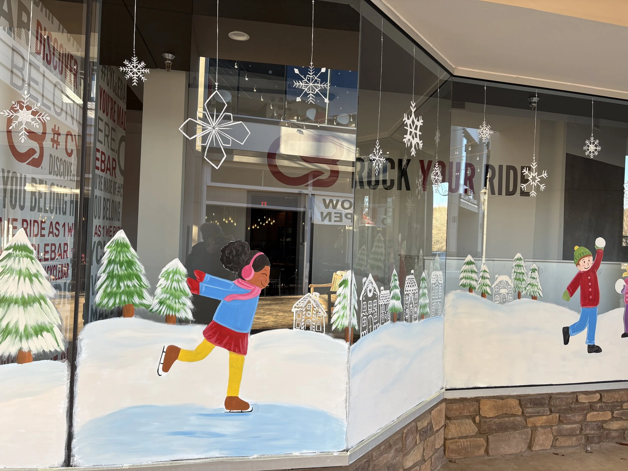 winter theme window mural of kid ice skating