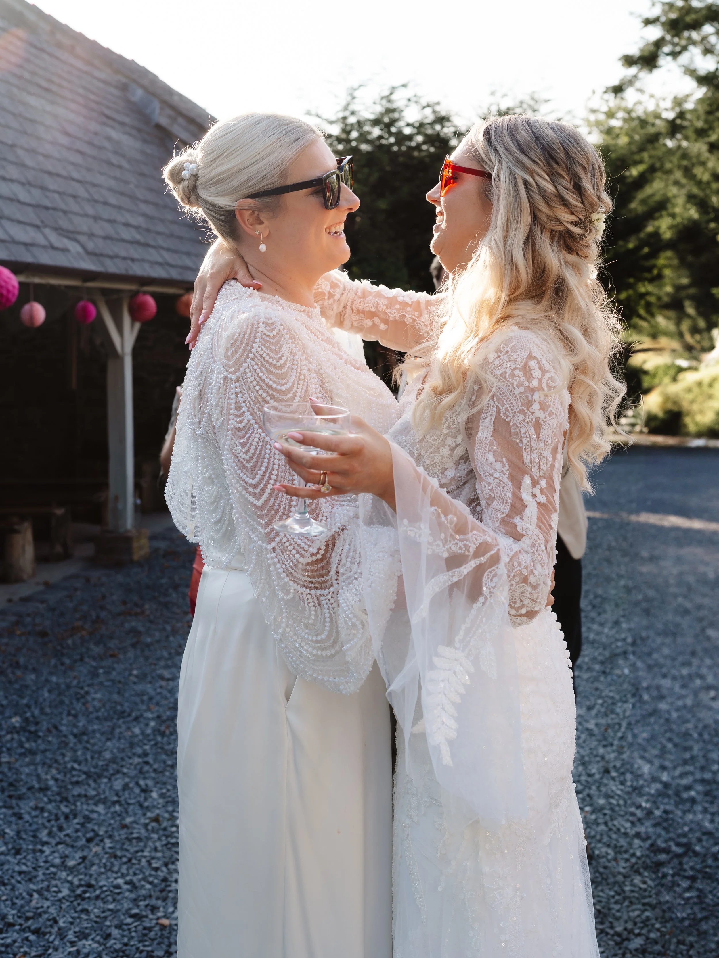 same sex wedding, two brides dancing in the sunlight