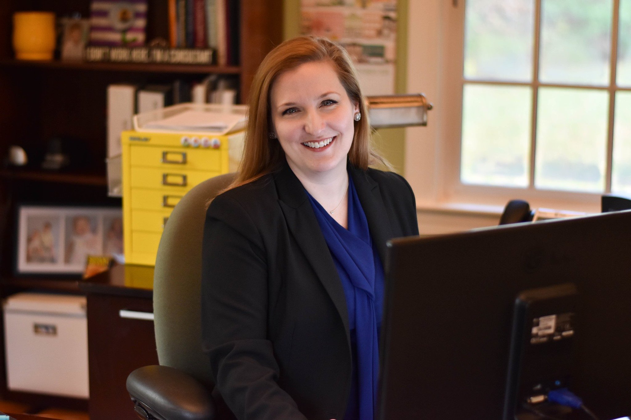 Sarah in the private office of her family's new home - 2019
