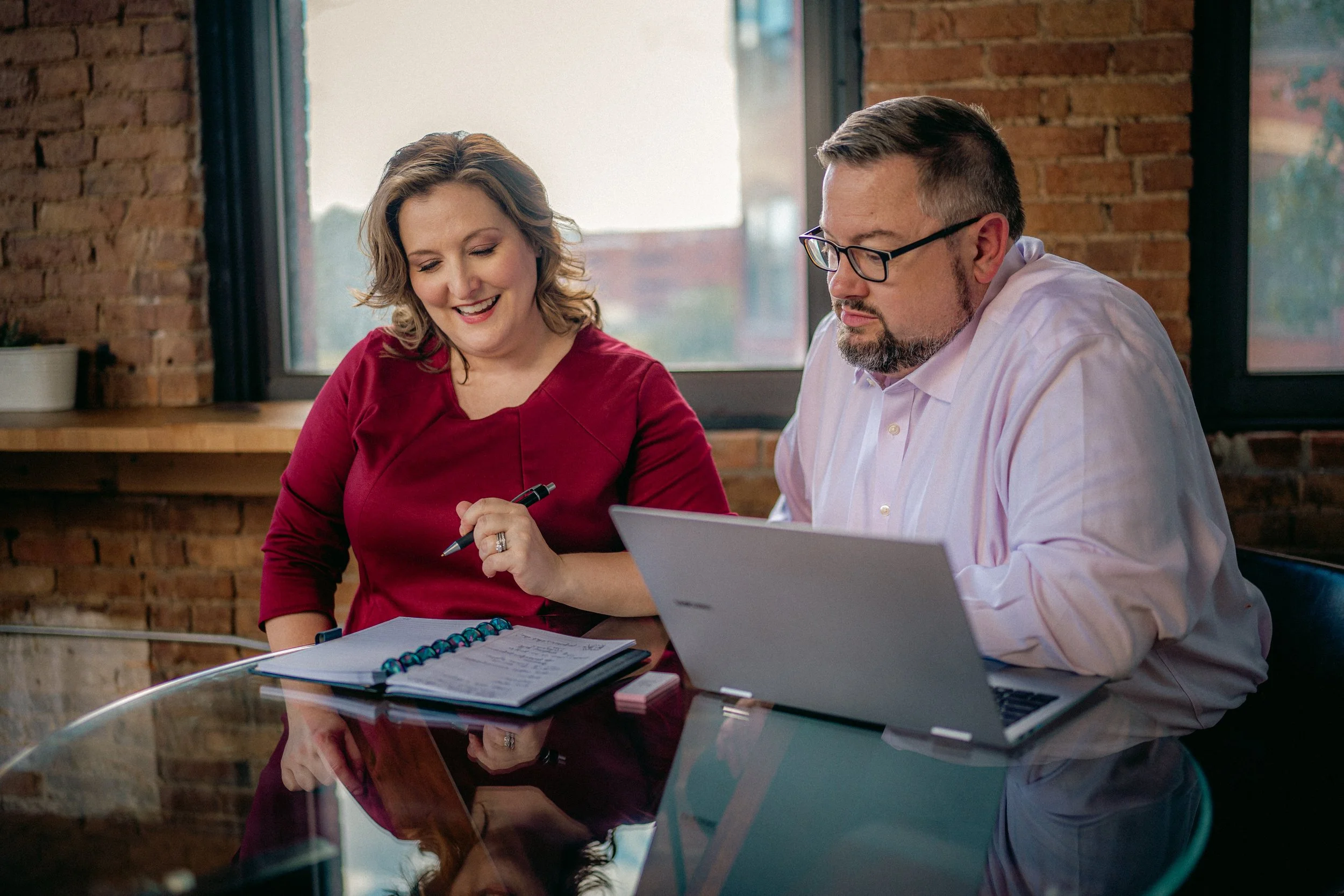 Fundraising consultants Sarah and Corey Jackson at desk