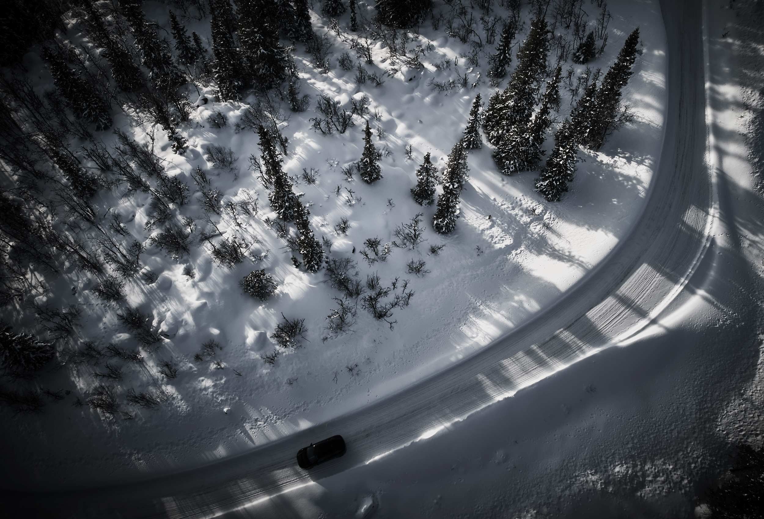 Jaguar I-PACE Land Rover in snow landscape. Car photography and drone video in Norway
