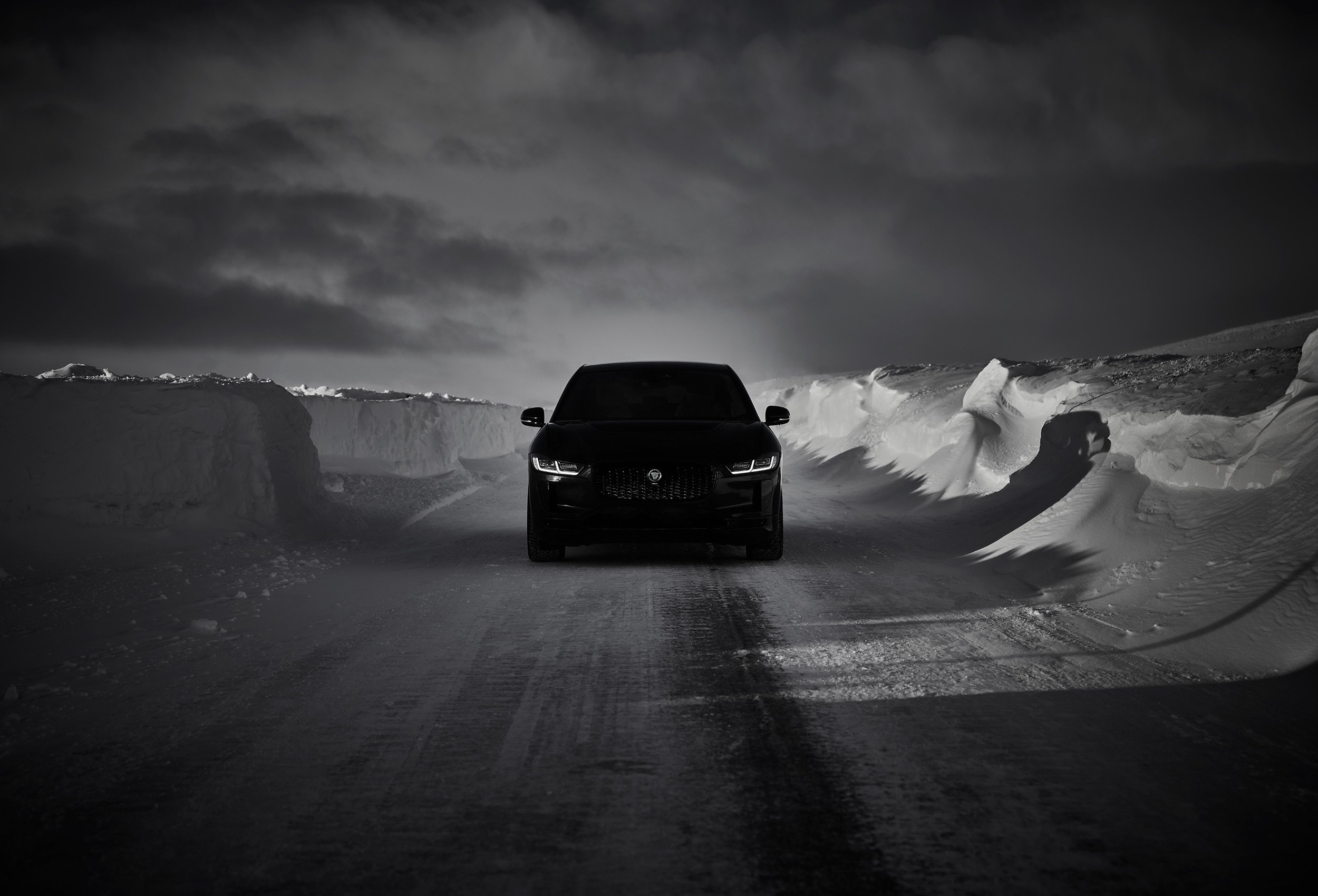 Jaguar I-PACE Land Rover in snow landscape. Car photography and drone video in Norway
