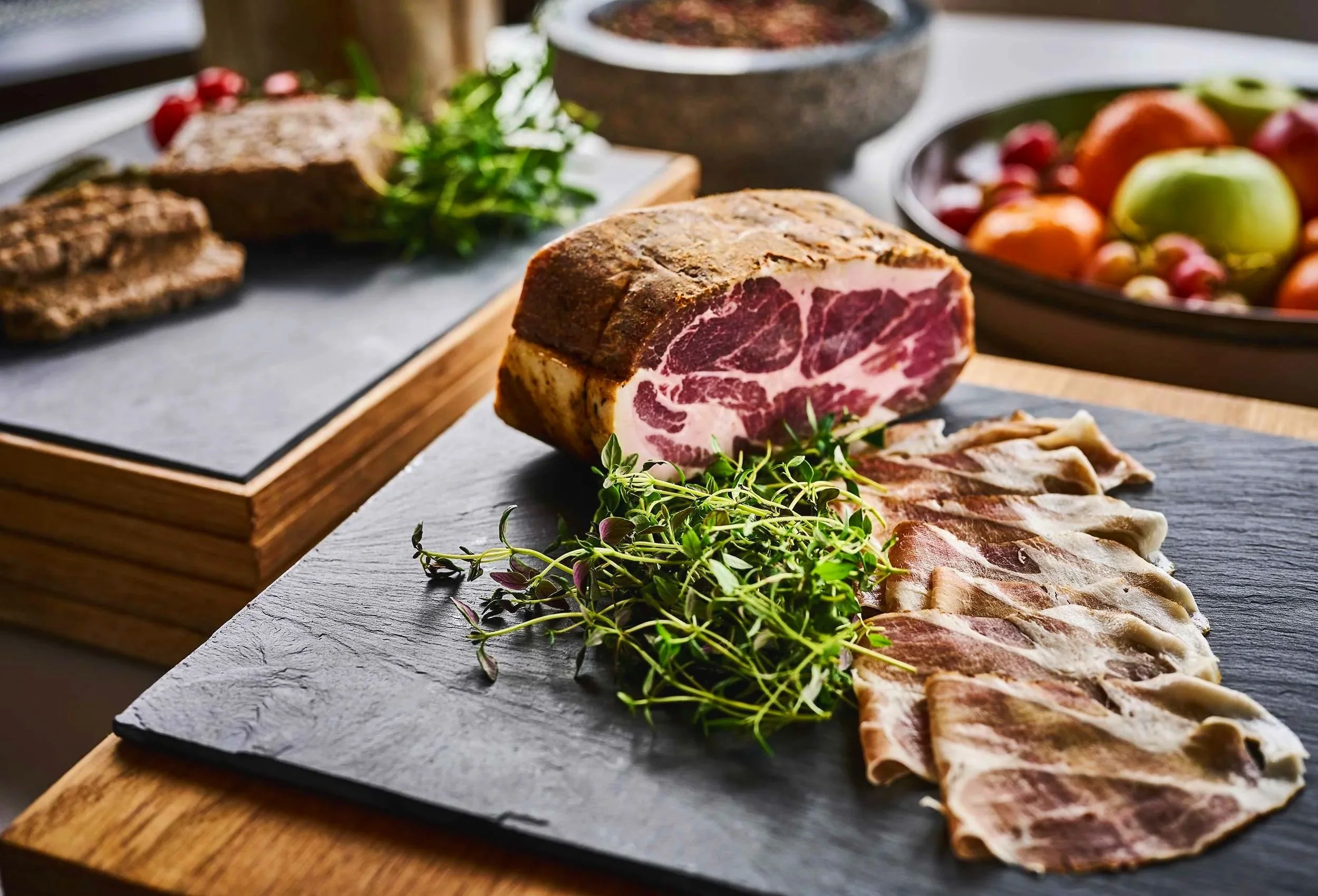 close-up from the breakfast buffet, toppings with cured ham 