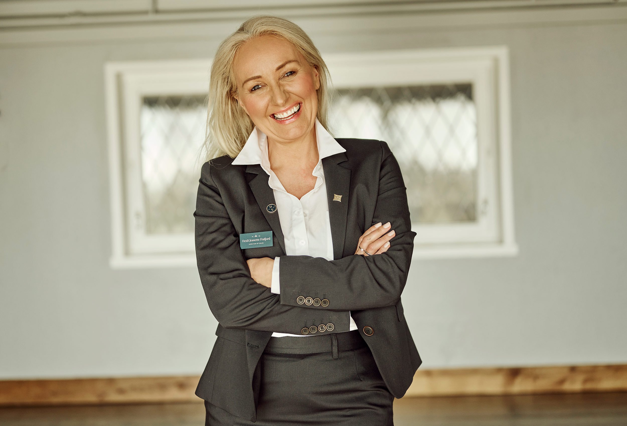 portrait of happy female employee at sola strand hotel and spa