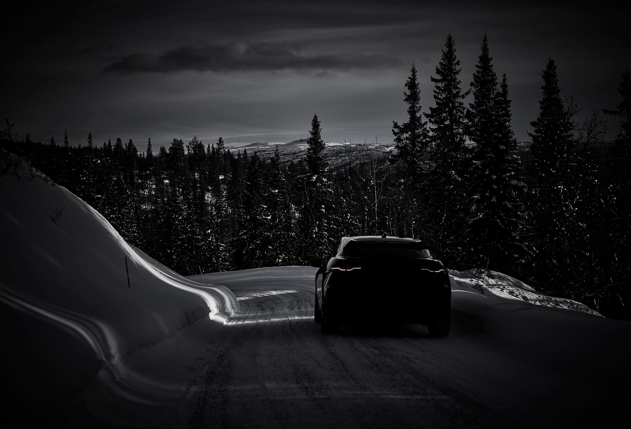 Jaguar I-PACE Land Rover in snow landscape. Car photography and drone video in Norway