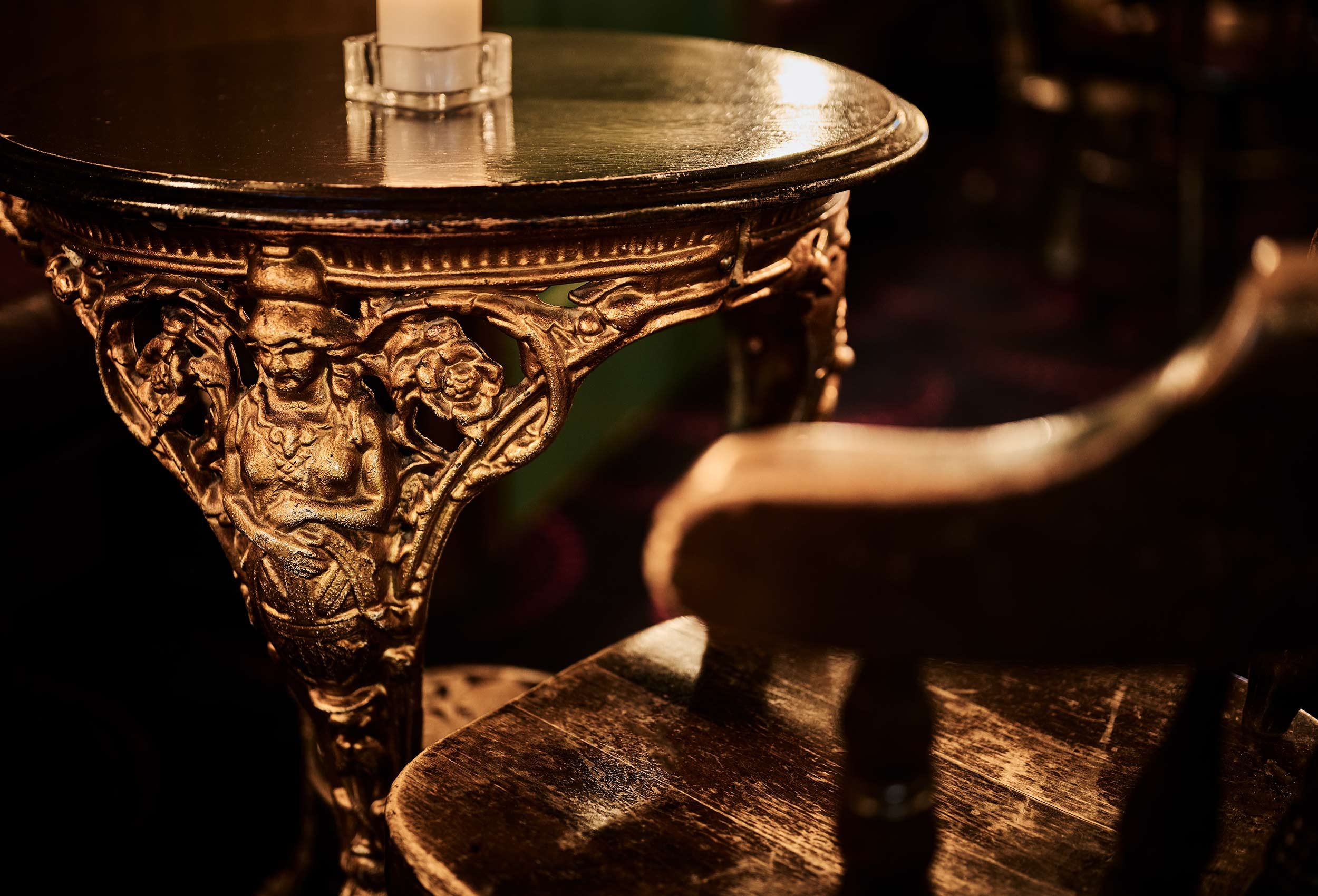 close-up of
old table with elegant carvings on the bar in Kristiansand