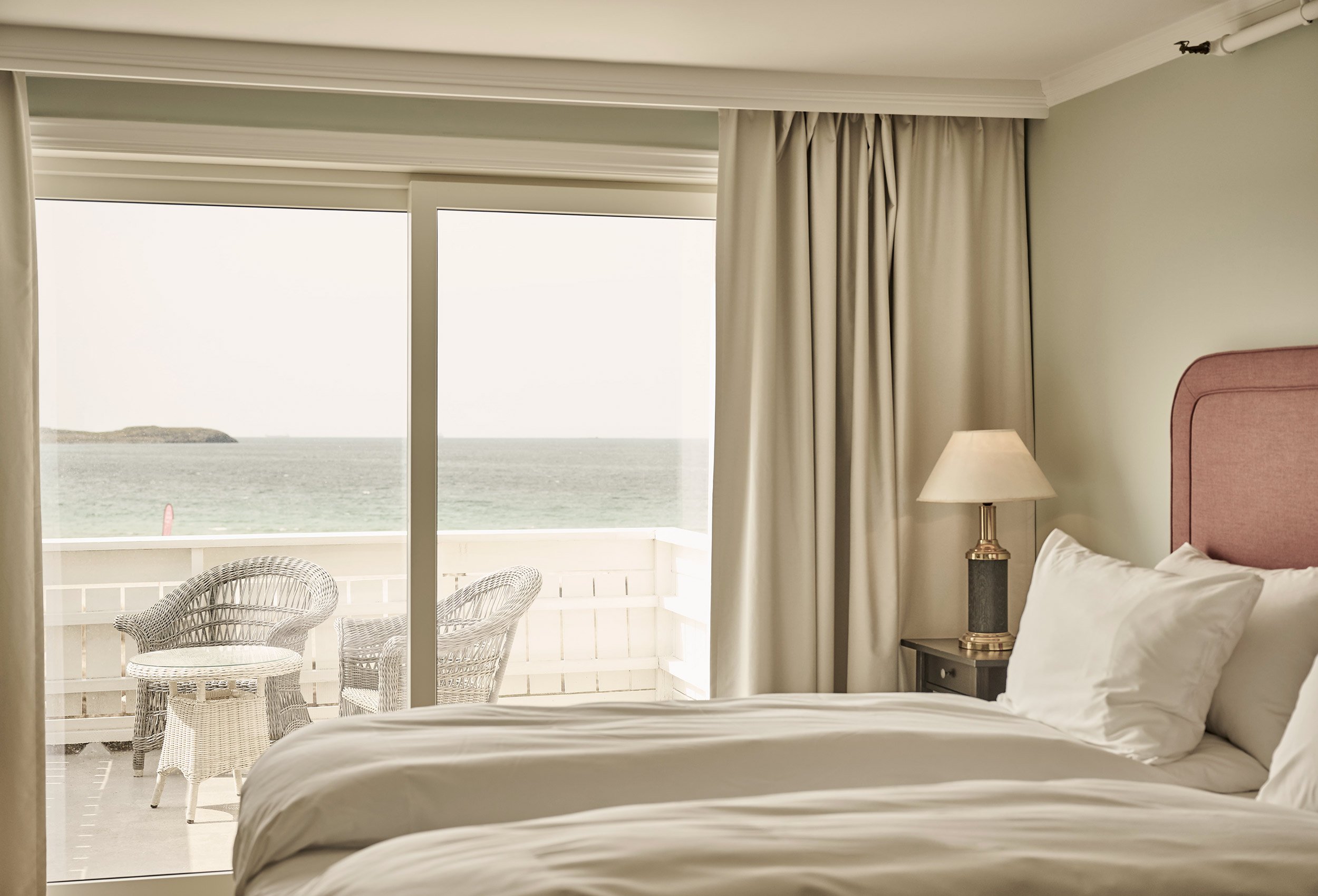 Sea view from a bed in a hotel room at the Sola beach hotel and spa in lovely summer light