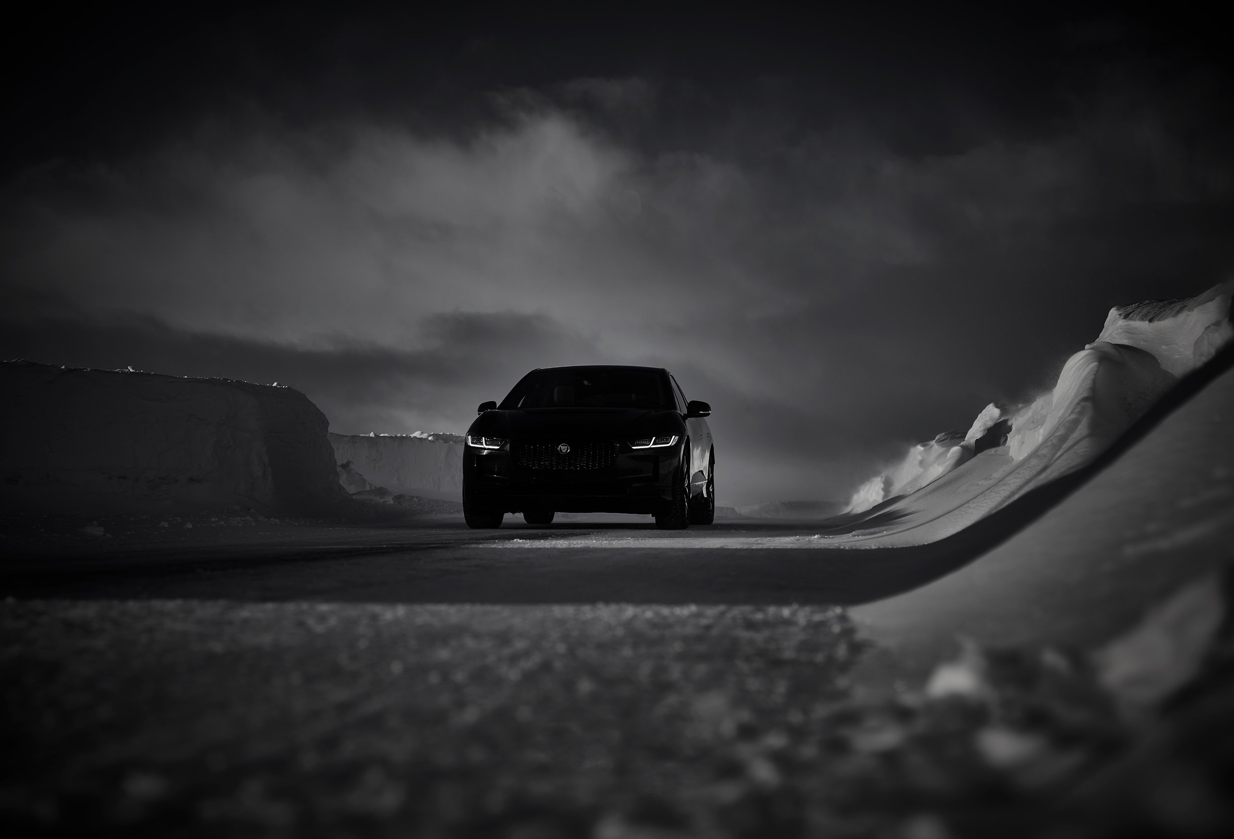Jaguar I-PACE Land Rover in snow landscape. Car photography and drone video in Norway