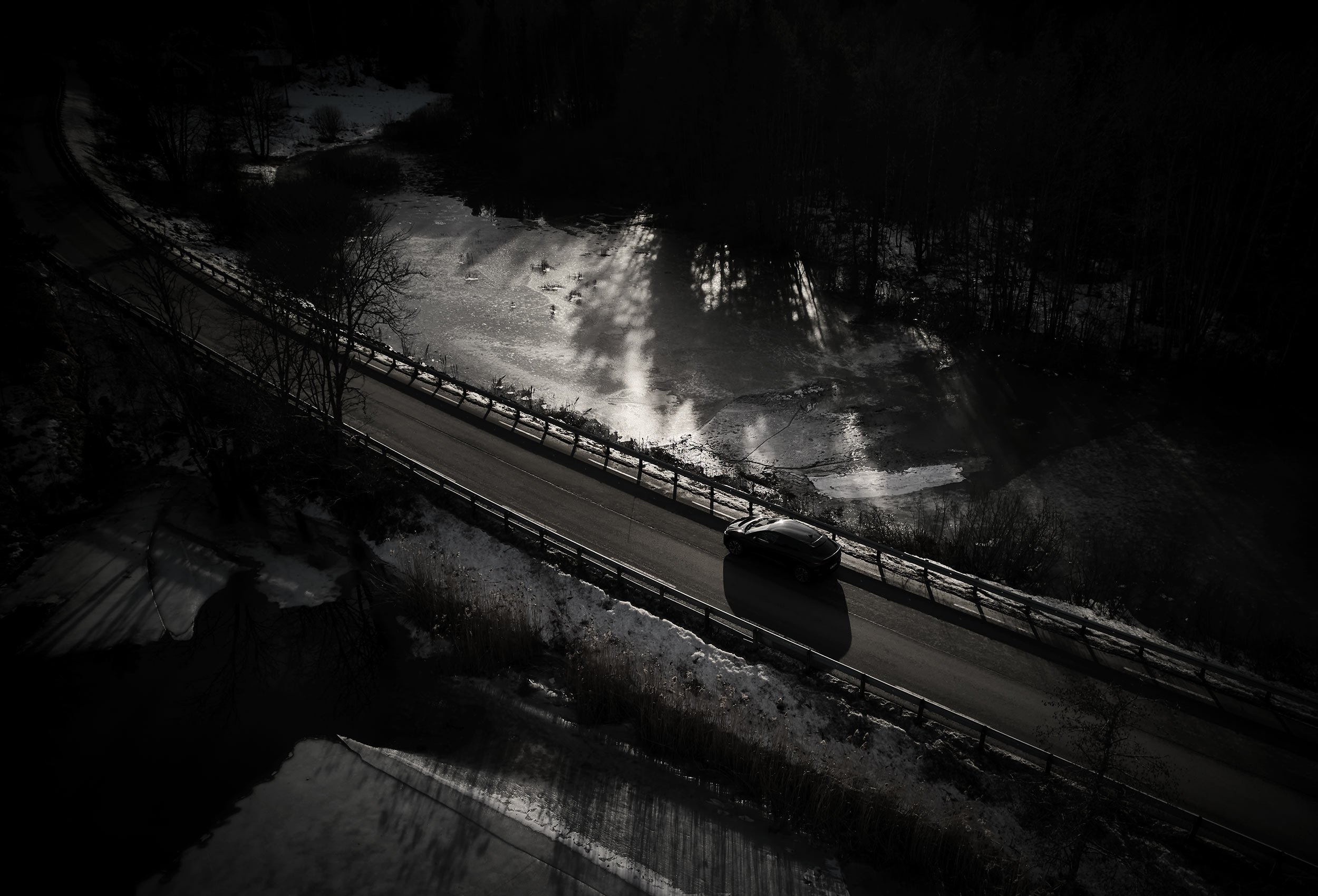 Jaguar I-PACE Land Rover in snow landscape. Car photography and drone video in Norway
